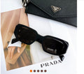 Women’s black Prada sunglasses